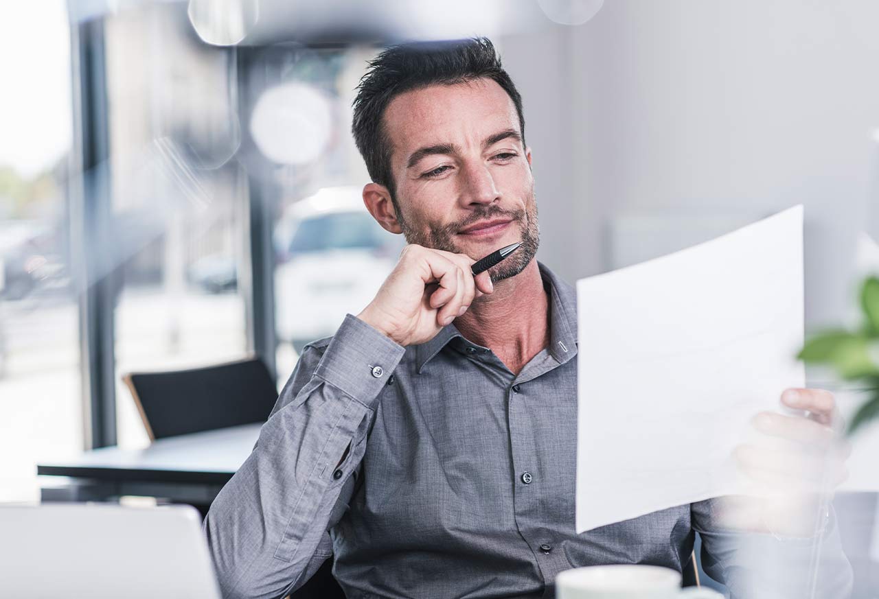 man reading a certified Rug Appraisal